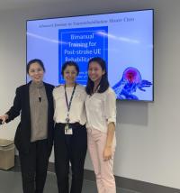 Students posing for a photo with a faculty member.